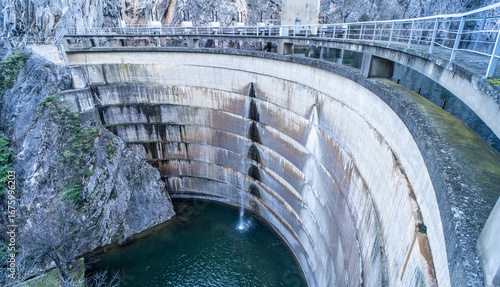 Wallpaper Mural Matka dam in Macedonia, spillway with water cascading over curved concrete walls. Torontodigital.ca