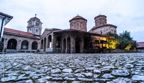 Wallpaper Mural Saint Naum Monastery - Macedonia ancient orthodox monastery with three domes and a stone courtyard at dusk. Torontodigital.ca