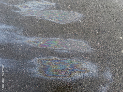 Stains of gasoline on asphalt