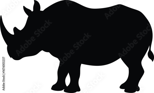 Powerful black silhouette of a rhinoceros in a dominant stance with two horns