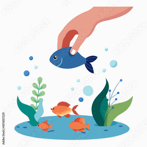 Caring hand gently introduces a new blue fish to an aquarium with vibrant orange fish and aquatic plants, creating a peaceful underwater scene