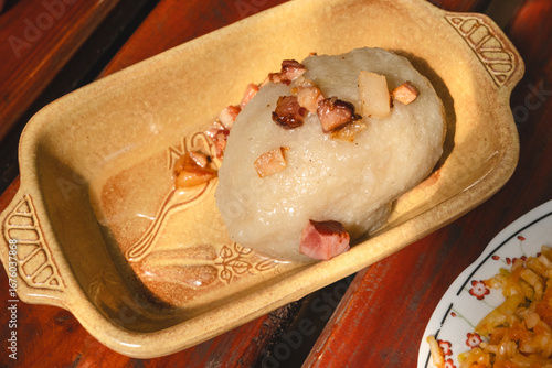 Fototapeta Naklejka Na Ścianę i Meble -  Kartacz (also cepelin) with minced meat - a regional dish popular in northeastern Poland in Warmia and Mazury