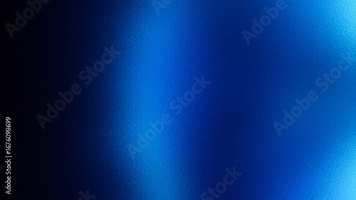 Abstract cool blue metallic brushed metal texture with light reflections and dark shadows