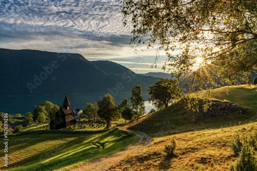 Ornes village and the historic Urnes Stave Church on the Lustrafjorden in Norway at sunset