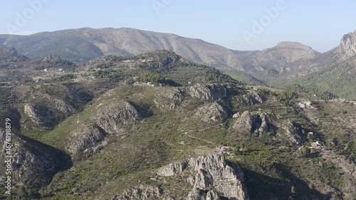 Wallpaper Mural Aerial view of Bolulla granite mountain range, cliffs and Mediterranean pine forests, in the area of La Marina Alta, Alicante, Spain.  Torontodigital.ca