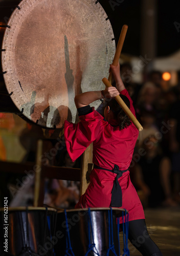 musician playing traditional Japanese taiko drum, Kumi-daiko performance
