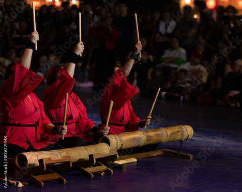 Red musicians in Kumi-daiko performance