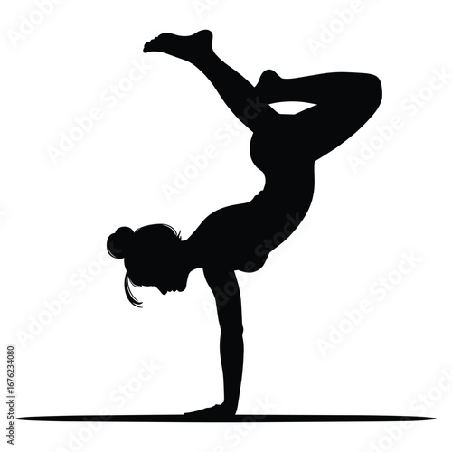 Woman performing a challenging yoga handstand pose silhouette