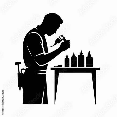 Silhouette of a craftsman working with precision tools and bottles on a table