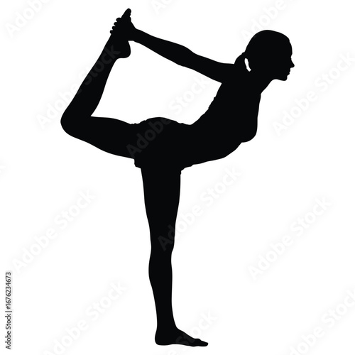 Woman performing yoga dancer pose silhouette
