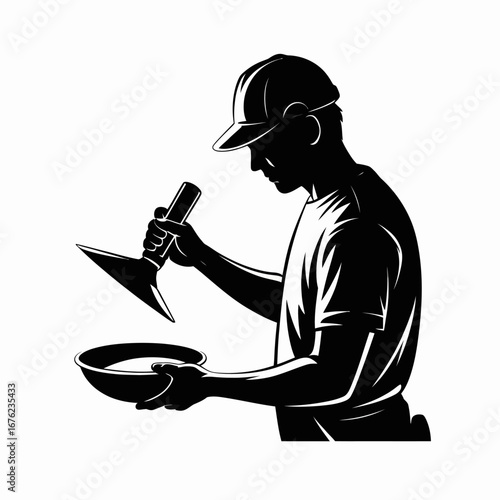 Silhouette of a construction worker applying plaster with a trowel