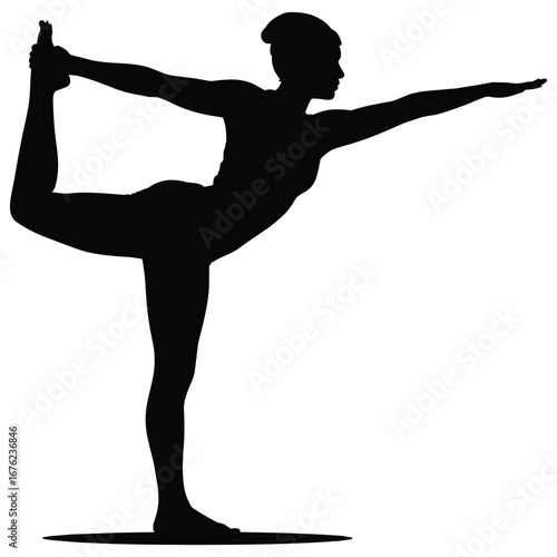 Woman practicing yoga in a graceful dancer pose silhouette