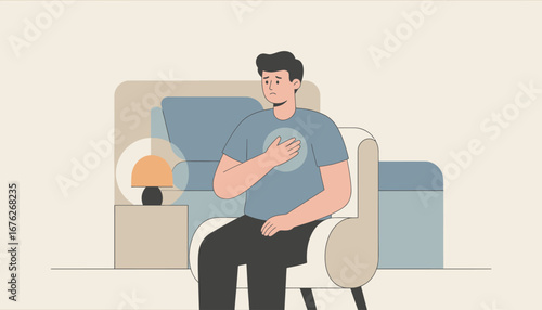 Man experiencing chest pain, sitting in a chair, at home, hand on his heart.