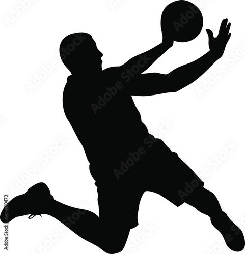 Dynamic silhouette of a basketball player in mid-air catching the ball action shot silhouette
