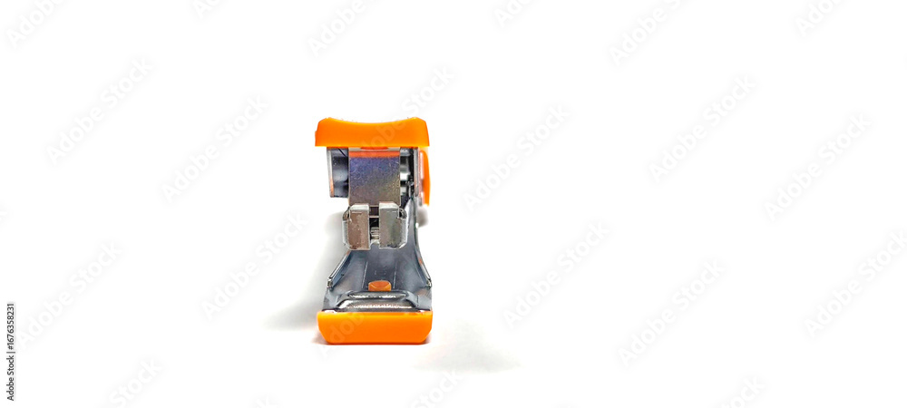 Fototapeta premium Orange stapler on white background