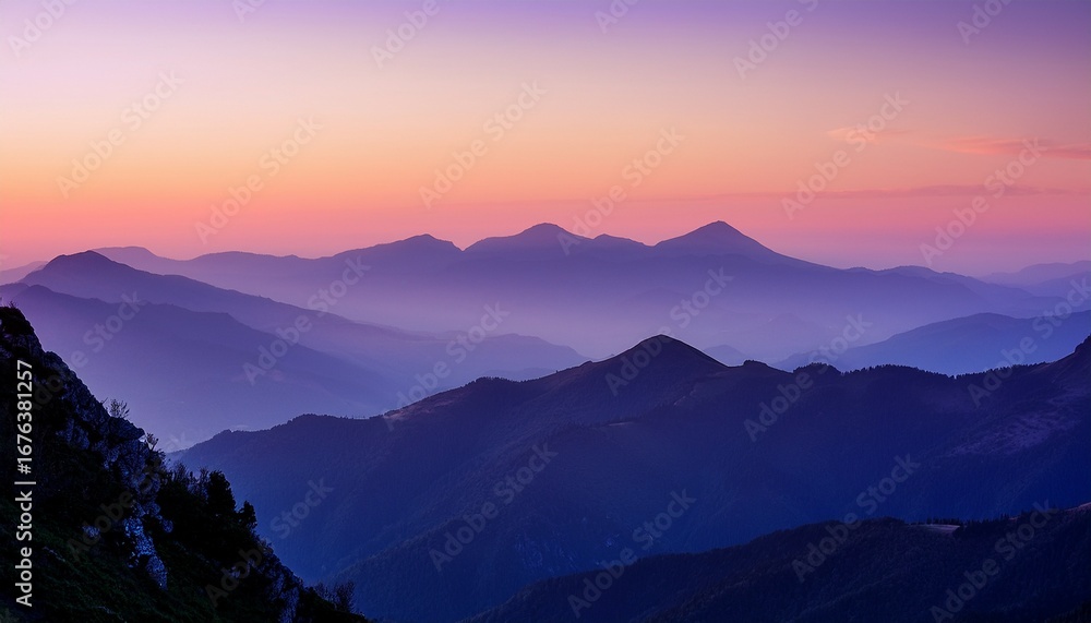 Fototapeta premium layered mountain ranges stretch into the distance during a hazy purple sunset creating a serene and picturesque landscape with soft light