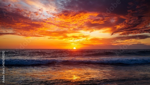 vivid sunset over the ocean with dramatic fiery orange and yellow clouds reflecting on waves creating a peaceful and awe inspiring atmosphere