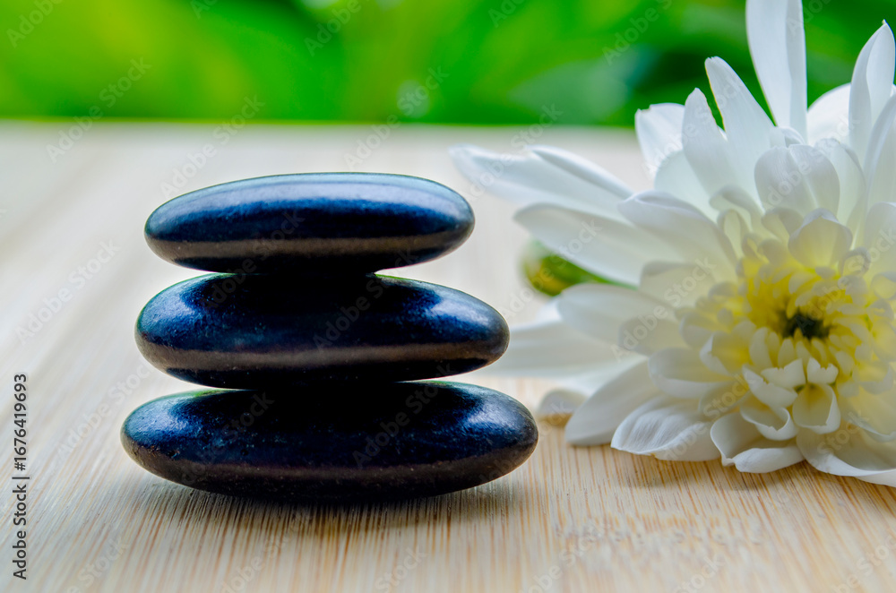 Fototapeta premium Balanced arrangement of zen stones with peaceful setting on wood with customizable space for text