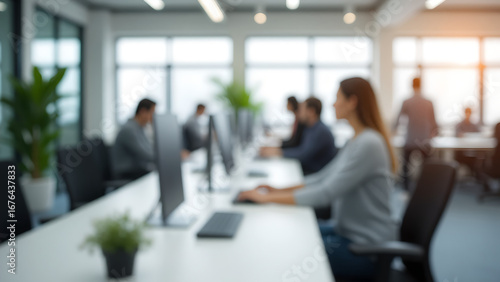 Blurred modern startup office environment, white desk with computer