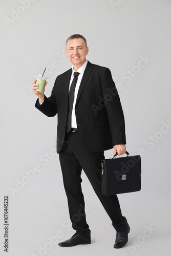 Mature businessman with gla...