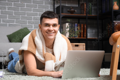 Male author using laptop on...