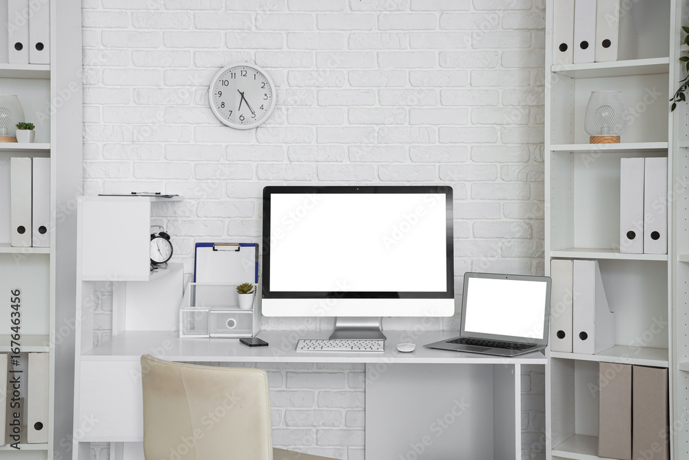 Obraz premium Interior of light office with modern workplace and shelf units