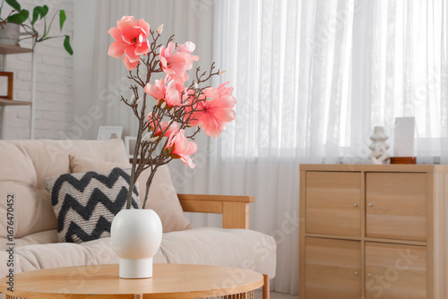 Vase with magnolia flowers ...