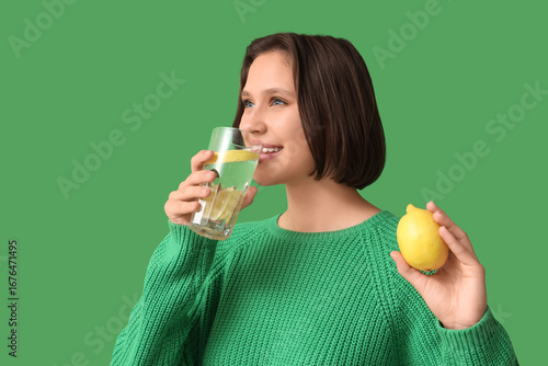 Pretty young woman drinking...