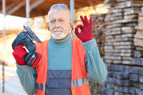 Mature male carpenter with ...
