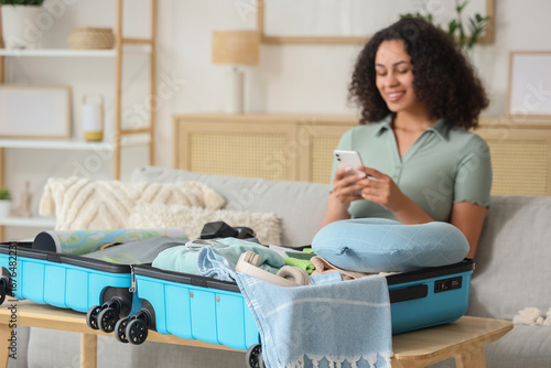 Open suitcase with travelli...