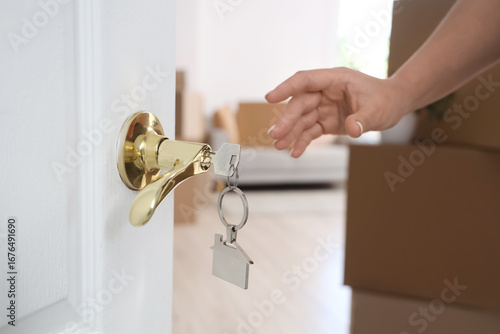 Female hand and key from ho...