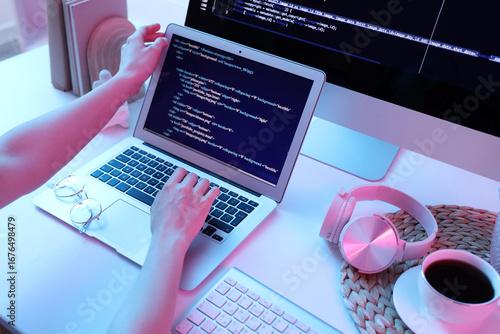 Female programmer's hands w...