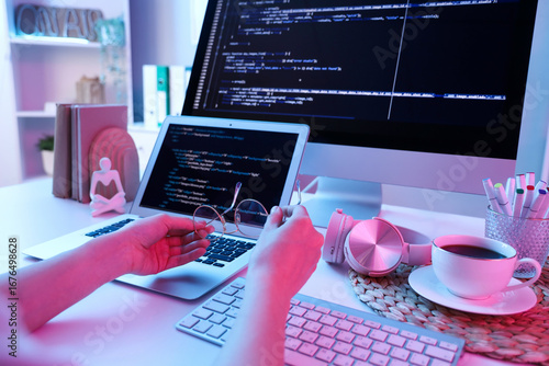 Female programmer hands hol...