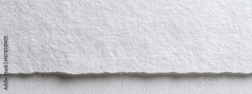 Close-up of textured white paper with uneven edges