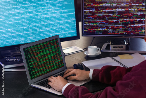 Hands of male programmer wo...