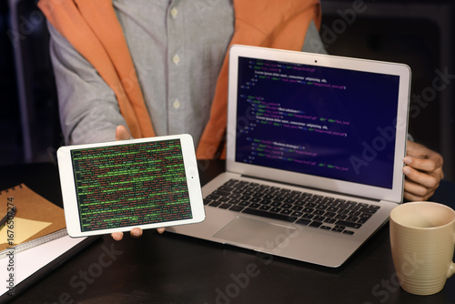 Male programmer with laptop...