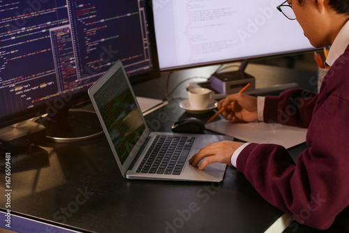 Male programmer working wit...