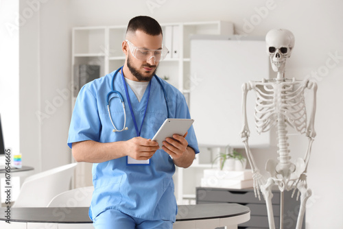Male doctor in AR glasses u...