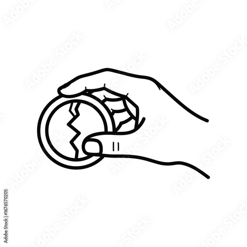 Broken Coin in Hand: A hand delicately cradles a cracked coin, its fragile state a poignant symbol of loss, financial hardship, or the devaluation of value.