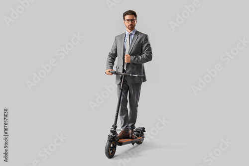 Handsome businessman riding...