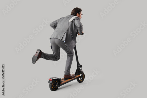 Handsome businessman riding...
