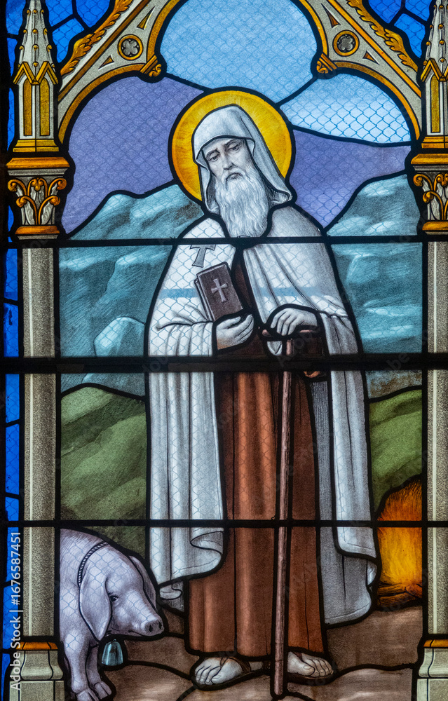 Obraz premium Stained glass (19th century) of Saint Antony the Great or the Hermit (251-356). Saint of the Roman Catholic Church.