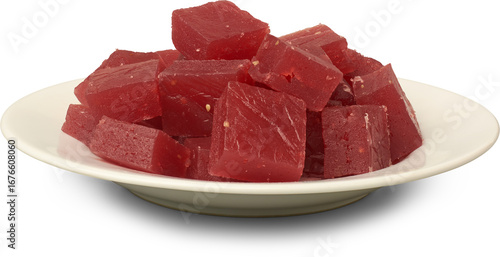 plate of red ghee musket or karachi halwa pieces isolated white background, aka bombay halva, traditional sri lankan or indian chewy sweet dessert 
