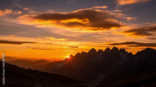 Wallpaper Mural Sunset over mountains with sun rays piercing through orange sky Torontodigital.ca