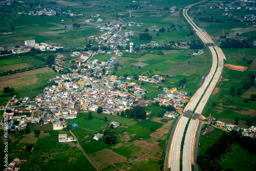 Aerial View of a Modern Highway and Rural Village in India