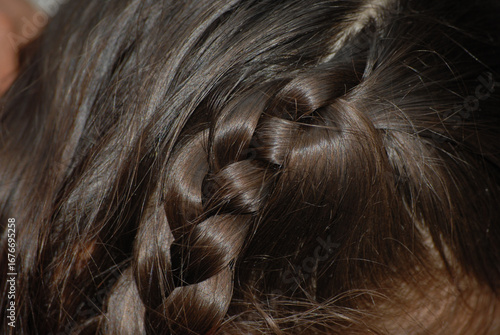 Close-up of a dark brown hair braid detail
