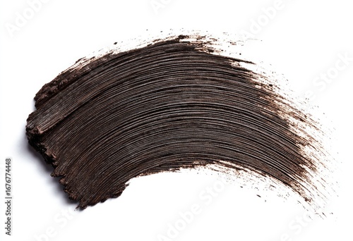 Dark brown makeup smudge on white background