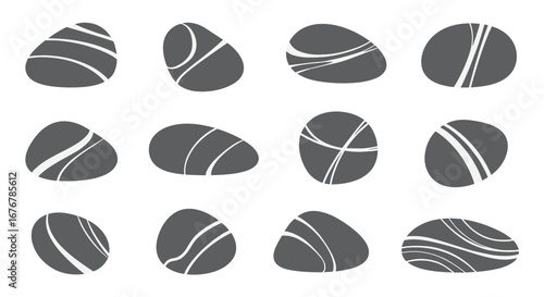 Collection of natural river stones with striking parallel line patterns for artistic projects