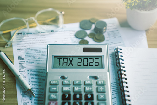 Obraz na plátně Tax planning and financial preparation for 2026 with calculator, income tax form