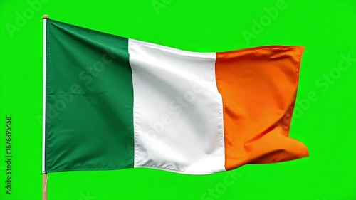 Dynamic Irish flag waving proudly against a vibrant green background, capturing national spirit and movement for patriotic celebrations and global events.
